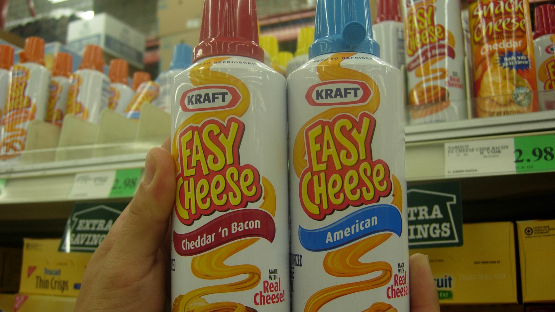 Some Easy Cheese bottles at a grocery store in Alaska, USA.