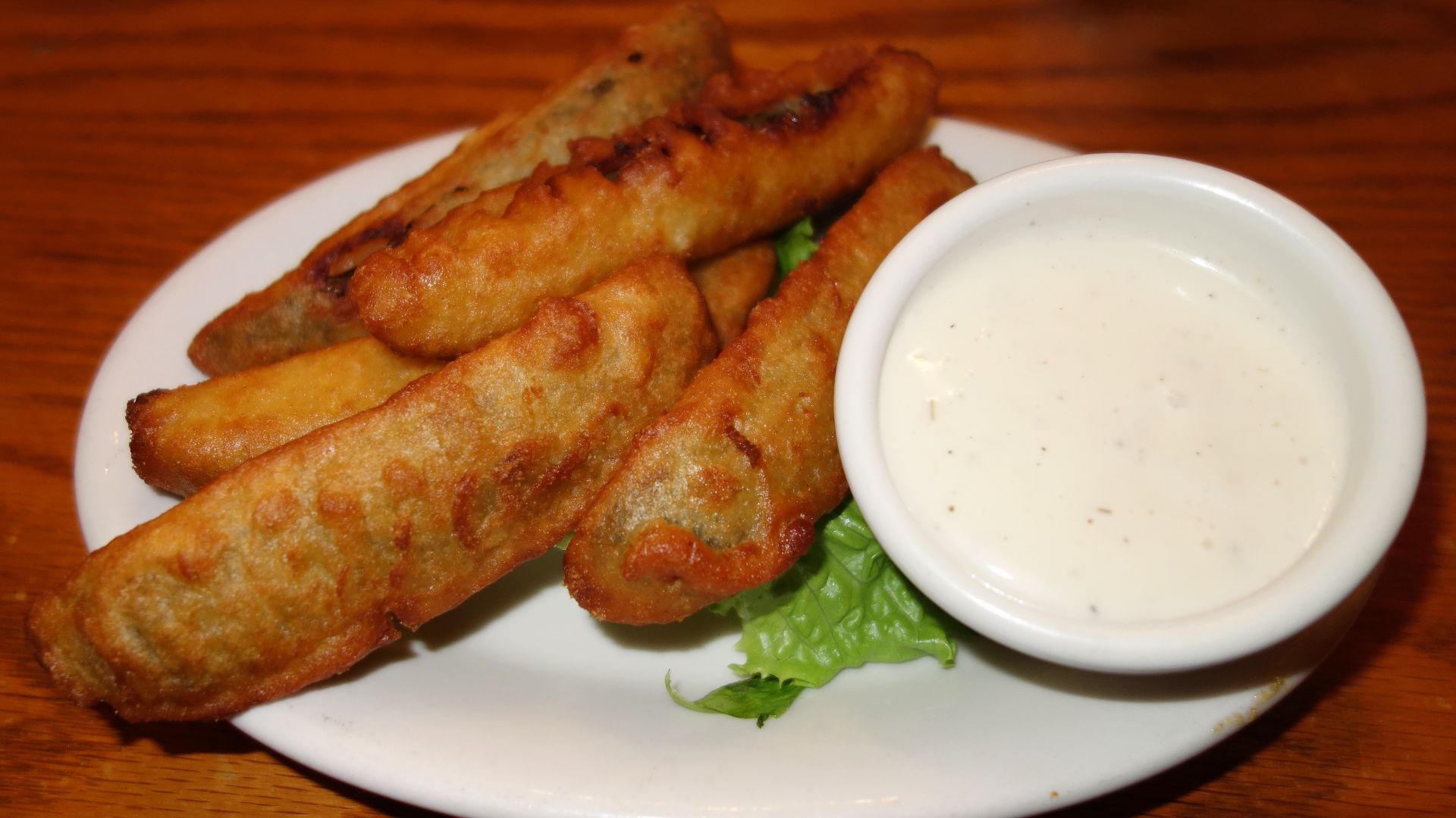Fried pickles with sauce - Mecklenburg Gardens, Cincinnati, Ohio, USA.