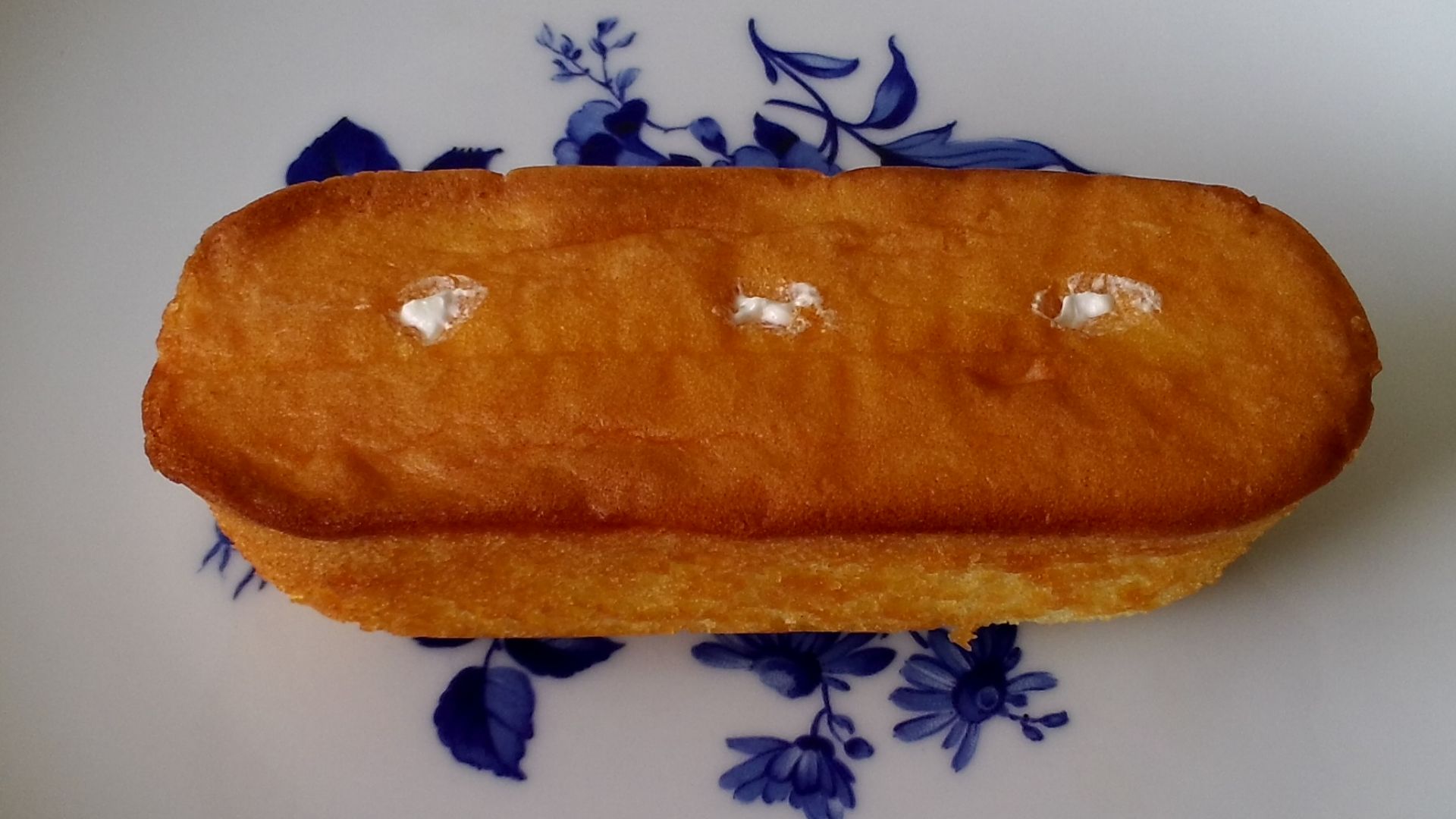 Bottom of Twinkie cake, showing the 3 holes used to inject the white cream filling.
