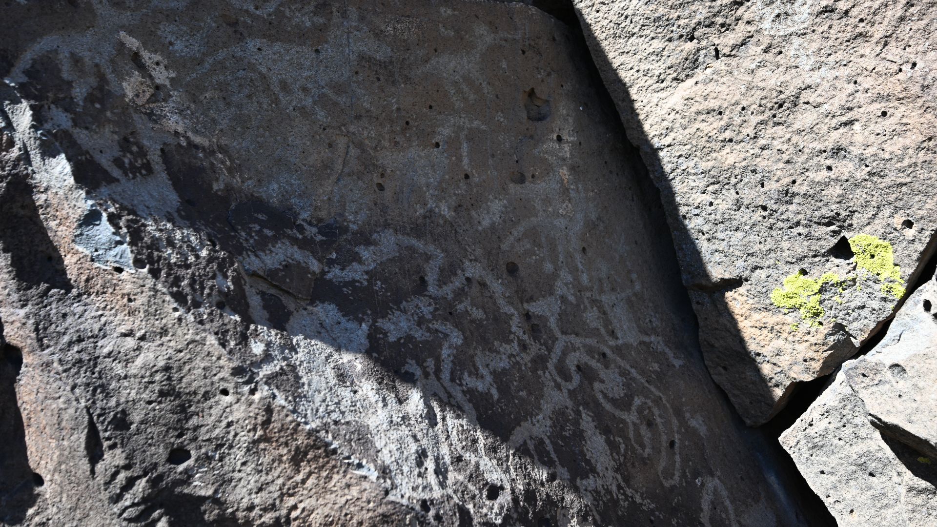 Petroglyphs on a rock at La Cieneguilla Petroglyph site outside of La Cienega, New Mexico.
