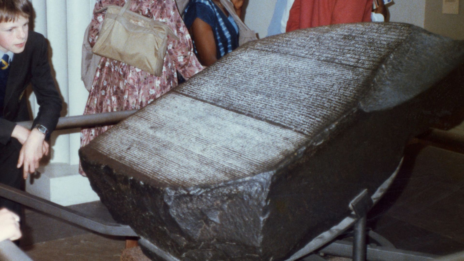 Patrons at the British Museum view the Rosetta Stone in 1985