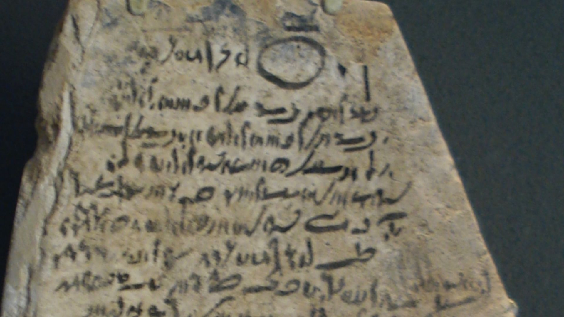 Ostracon with Demotic inscription.  Limestone.  Ptolemaic Period, c. 305-30 BC-(?330-305 BC?).  Probably from Thebes.  It is a prayer to the god Amun to heal a man's blindness.  It concludes: