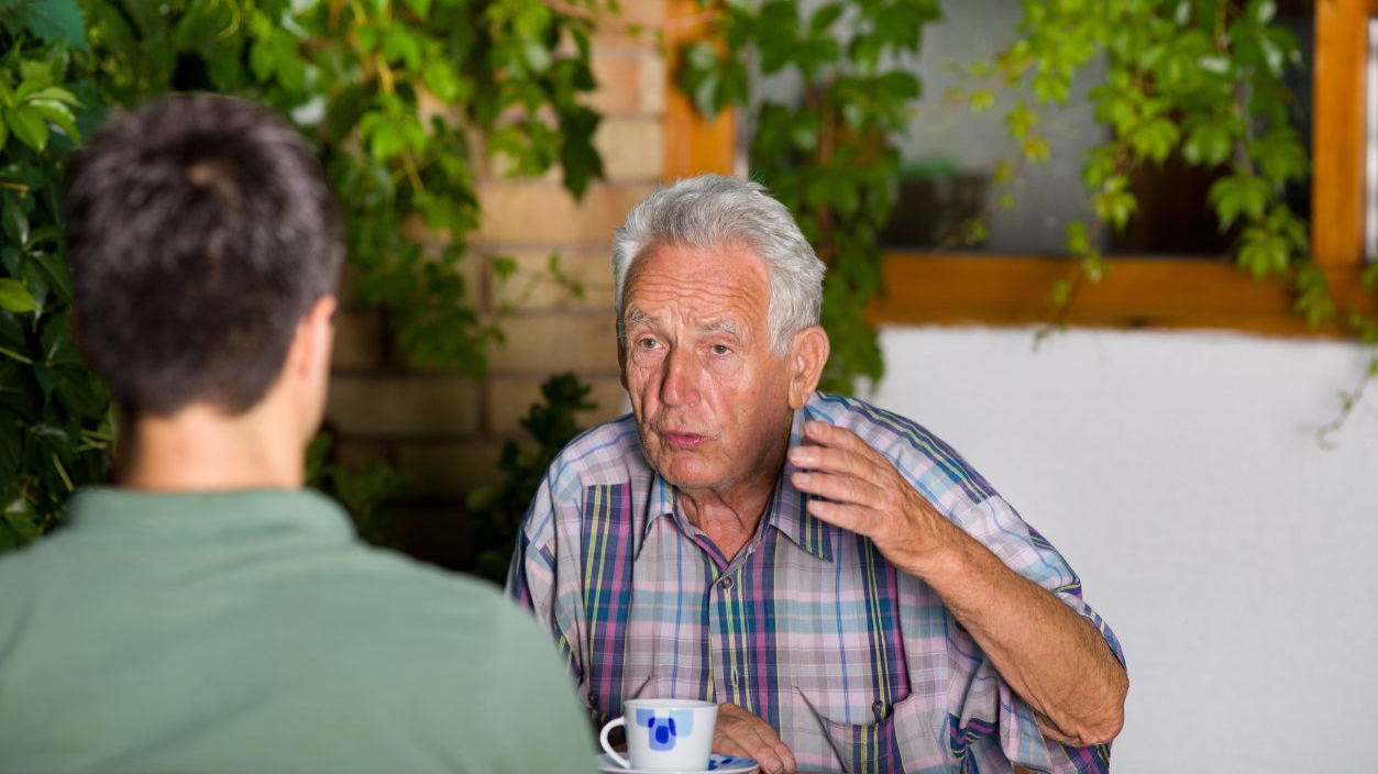 Shutterstock-213649564, Serious old man talking with grandson and explaining by hand