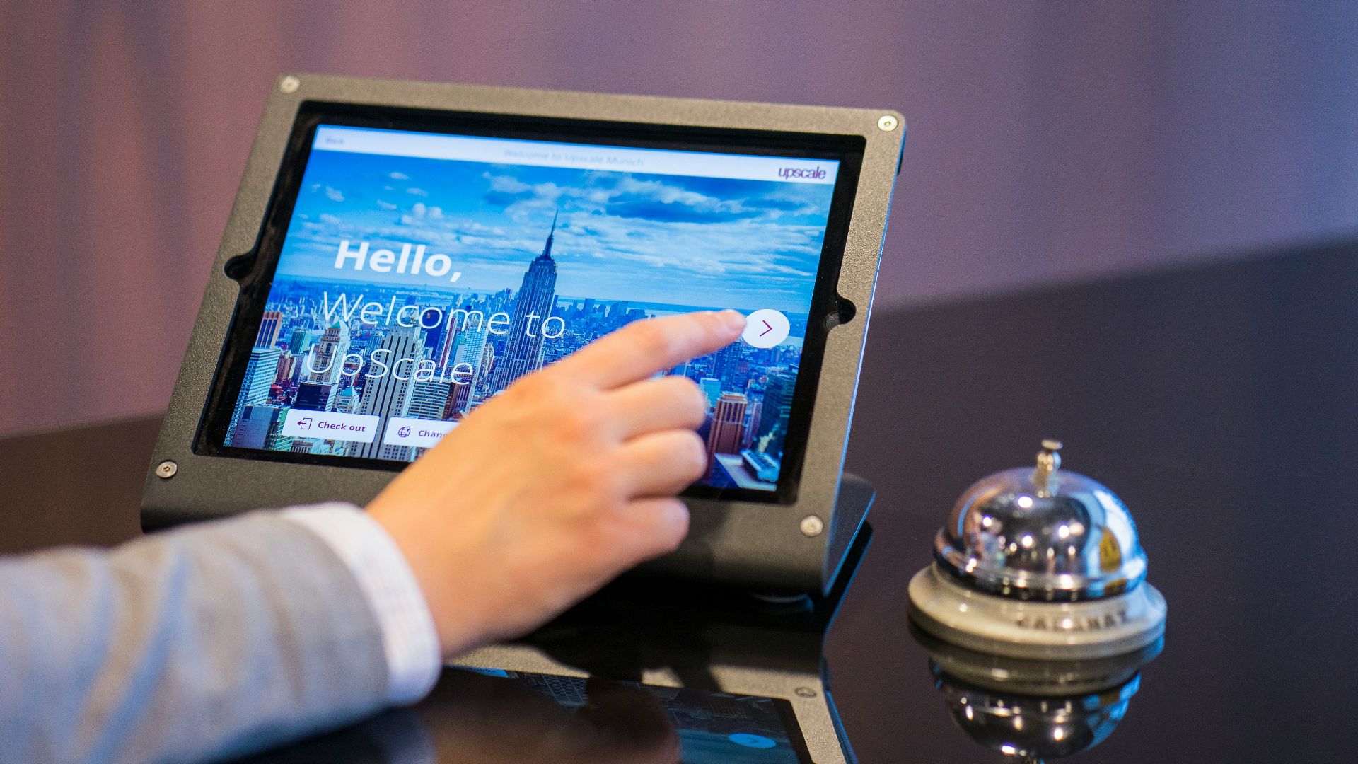 person about to touch black Android tablet computer