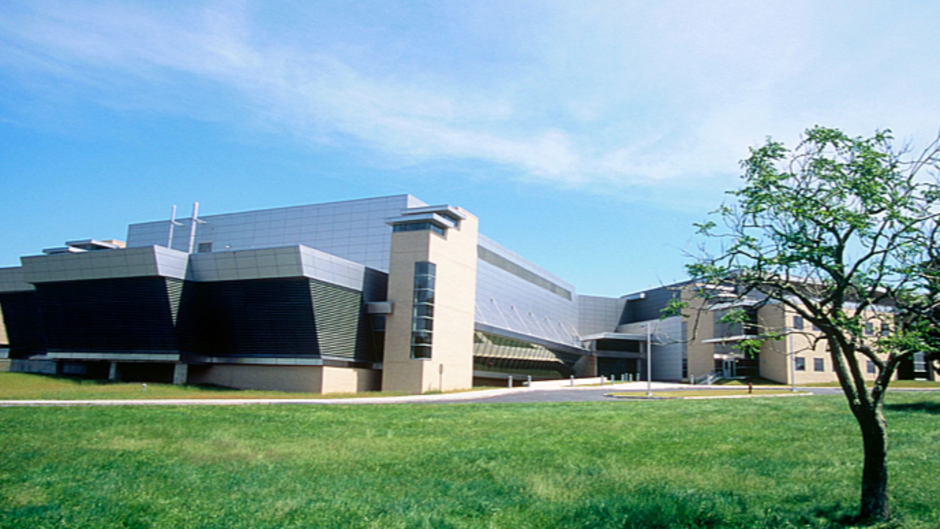 Photograph of the NIST Advanced Measurement Laboratory (AML) building Gaitherburg, MD. The NIST Advanced Measurement Laboratory building was designed by HDR Architecture Inc., and built by Clark/Gilford, Joint Venture. Construction began on the building o