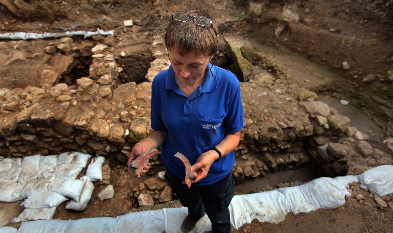 Israeli archaeologist Yardenna Alexandre inspects Roman 1st century AD pottery found in an excavation which reveals for the first time a Jesus-era house from the Jewish village of Nazareth on December 21, 2009 in this biblical city in northern Israel. The