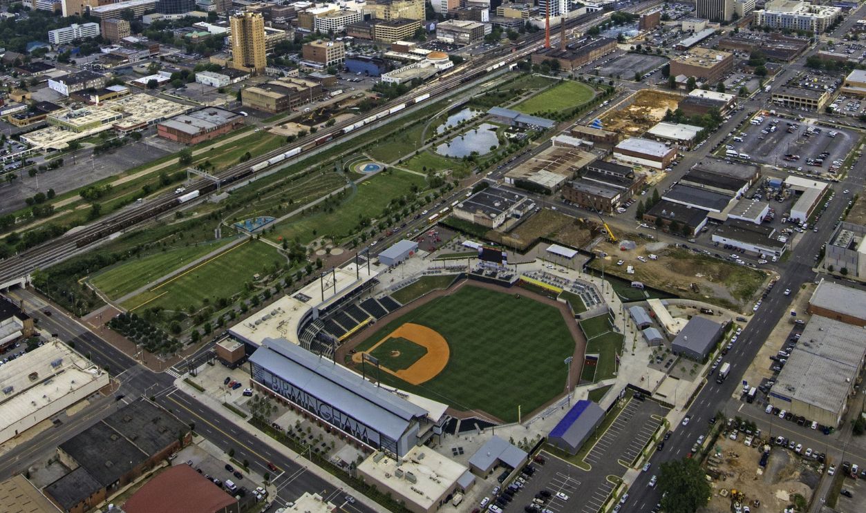 Railroad Park Birmingham Alabama Aerial view of a baseball field and surrounding urban area in a bustling city