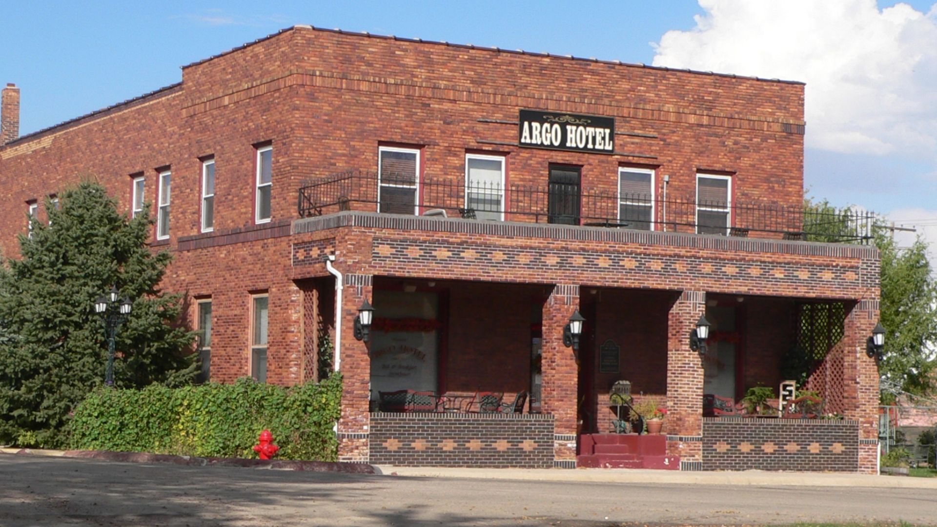 Argo Hotel, located at northeast corner of Kansas and West 3rd Streets in Crofton, Nebraska; seen from the southwest. The hotel was constructed in 1912, and is listed in the National Register of Historic Places. It continues to serve as a hotel and rest