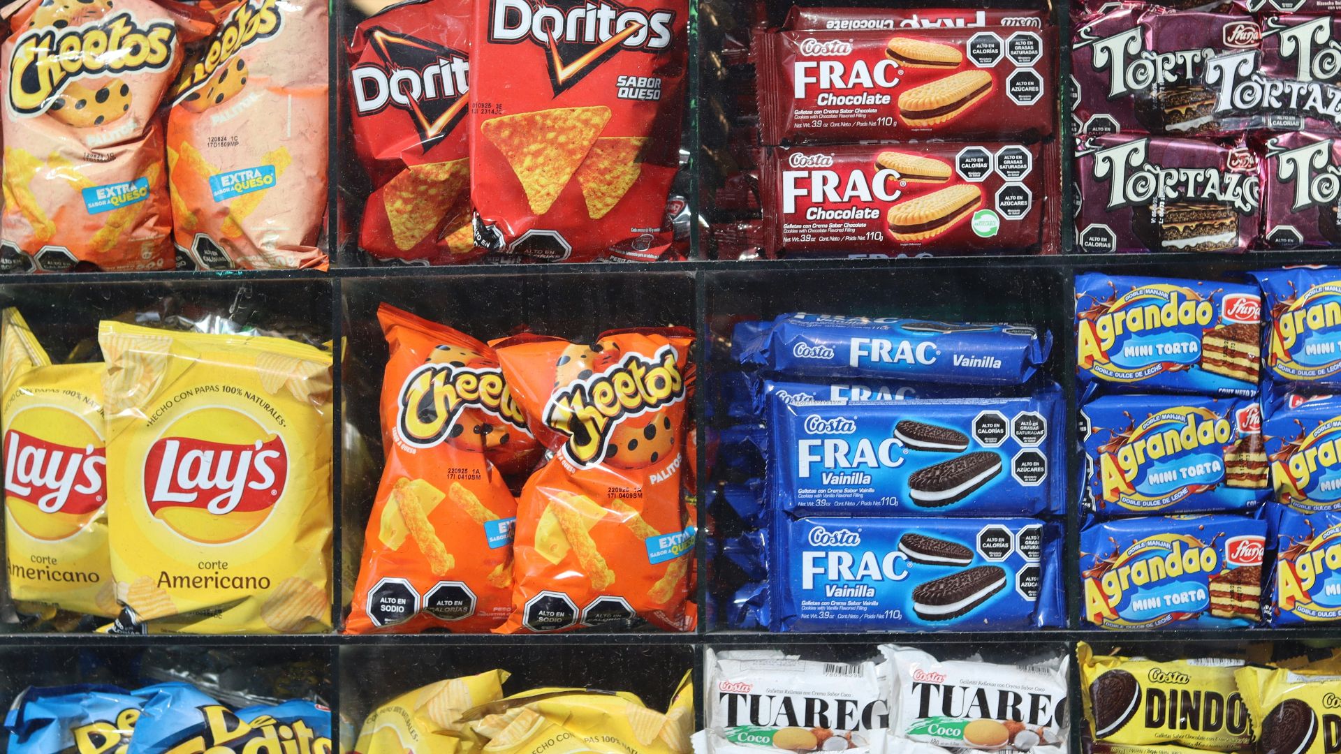 Shelves are filled with various snacks and drinks