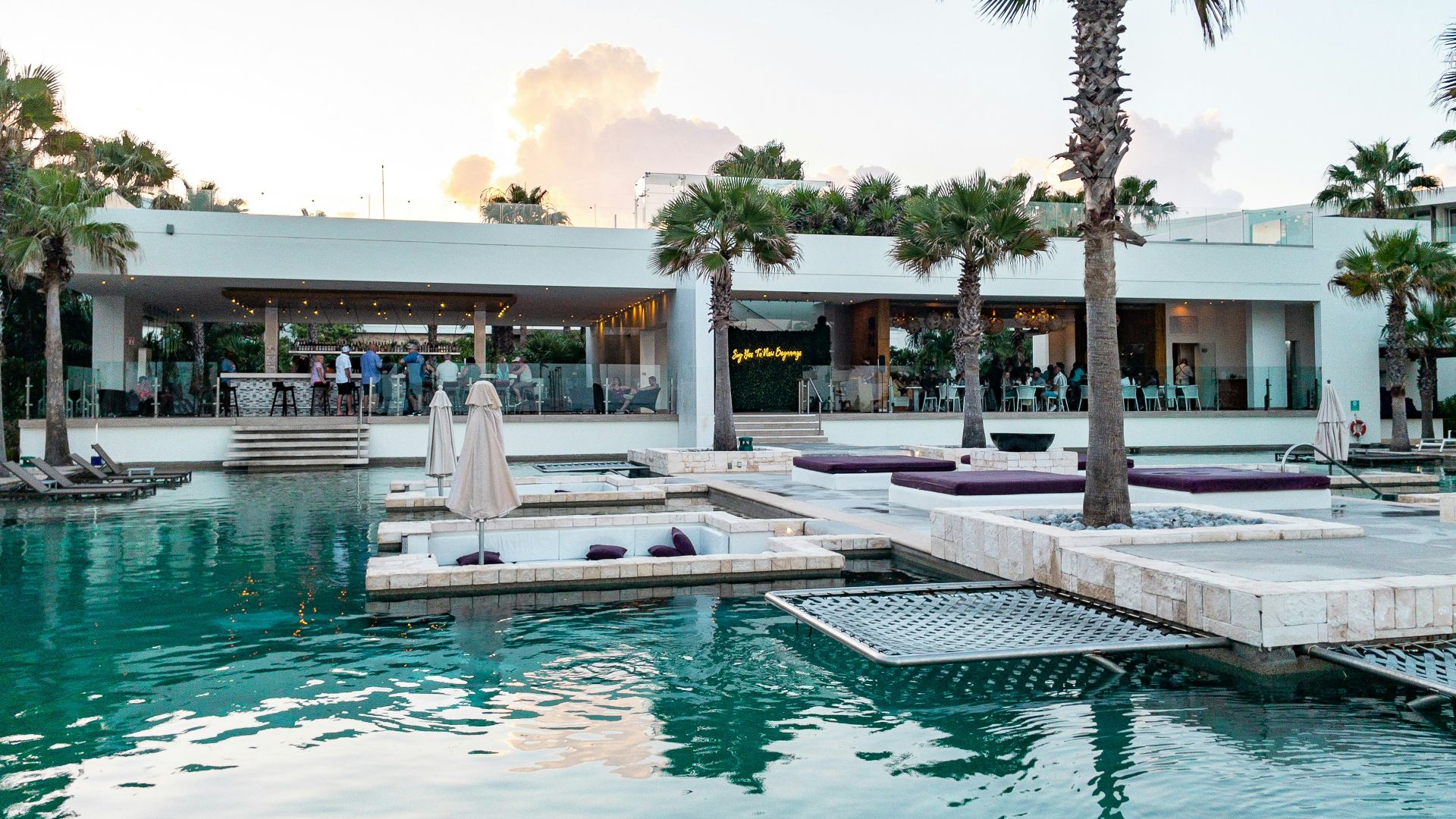 a pool with a building in the background