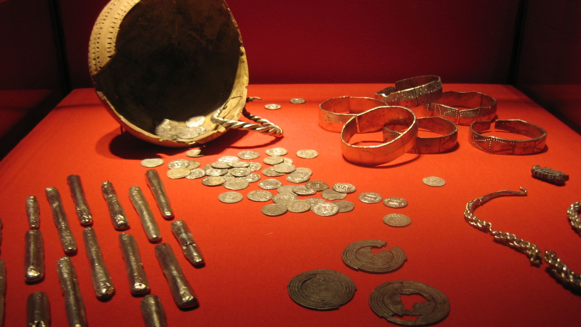 A hoard of Viking treasure now located in the Rijksmuseum van Oudheden (Leiden Museum). NOTE: This image makes the horde appear to consist of gold while in fact it is all silver. See [1] and [2] for true color image and history of this find.