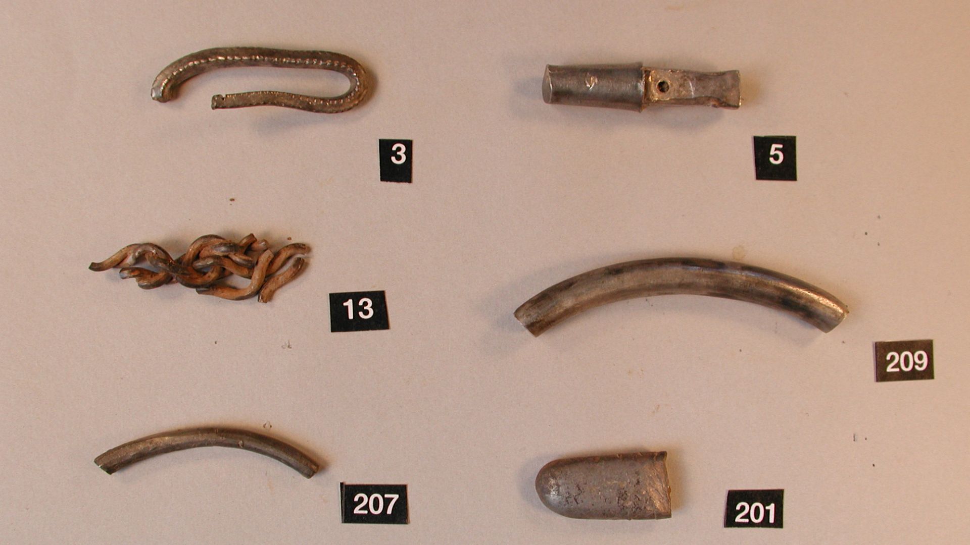 The hoard comprises both items of Viking jewellery and coins recovered from a field near to the site of the discovery of a separate, coinless hoard of seven Viking-period brooches in 1989 (which was subsequently acquired by the British Museum in 1991; it 