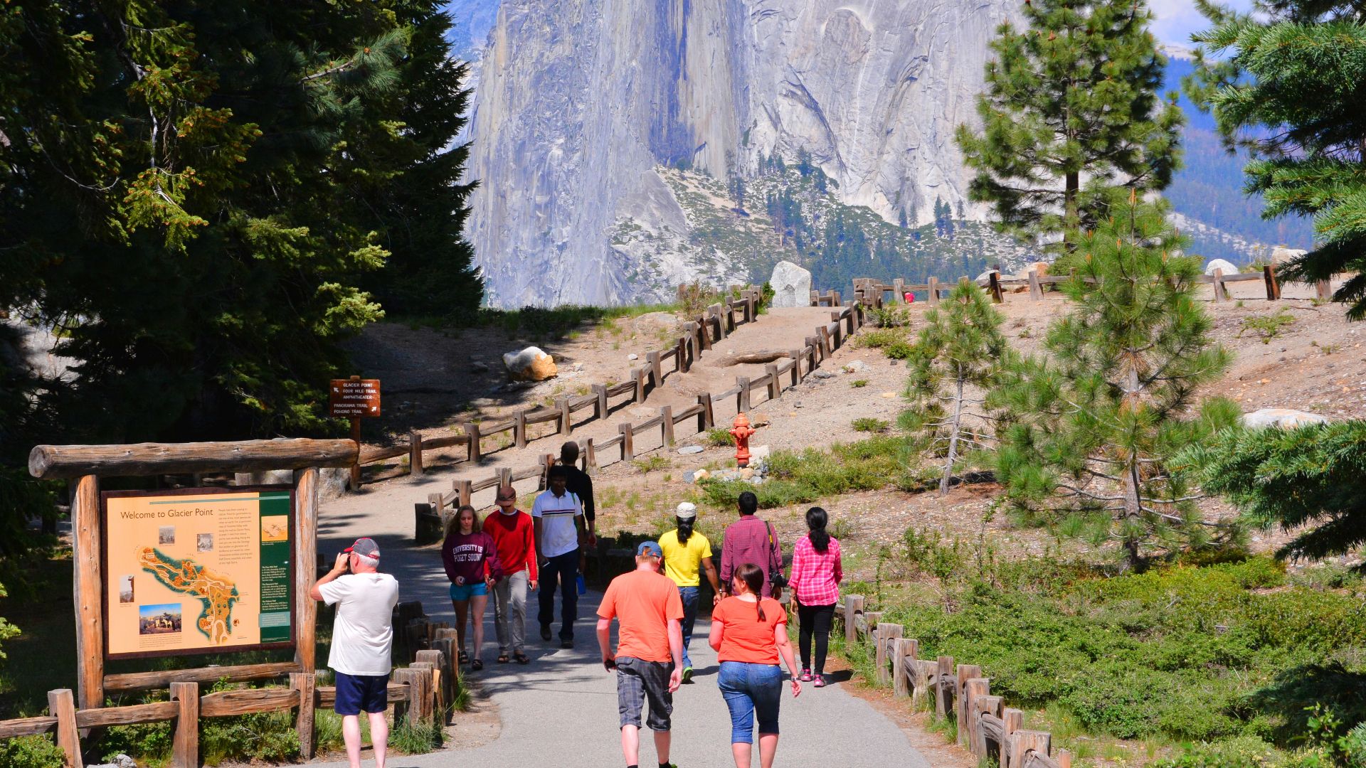 Glacier point is a spectacular viewpoint sitting 3000 feet above Yosemite Valley.
You get great views of many parts of the National Park, including awesome Half Dome (in this picture).
Here tourists make the short walk from the car park to the viewpoint.