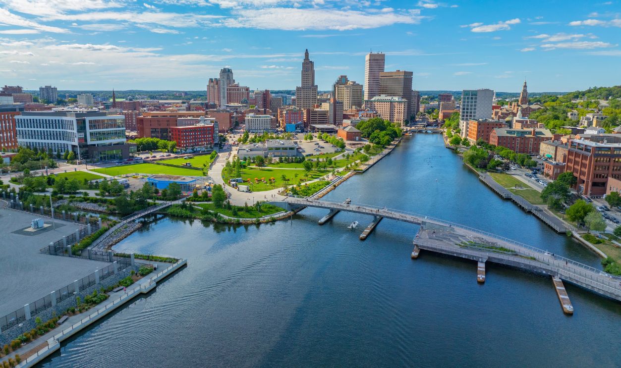 Providence River aerial view including Michael S. Van Leesten Memorial Bridge, with modern city skyline at the background, downtown Providence, Rhode Island RI, USA.