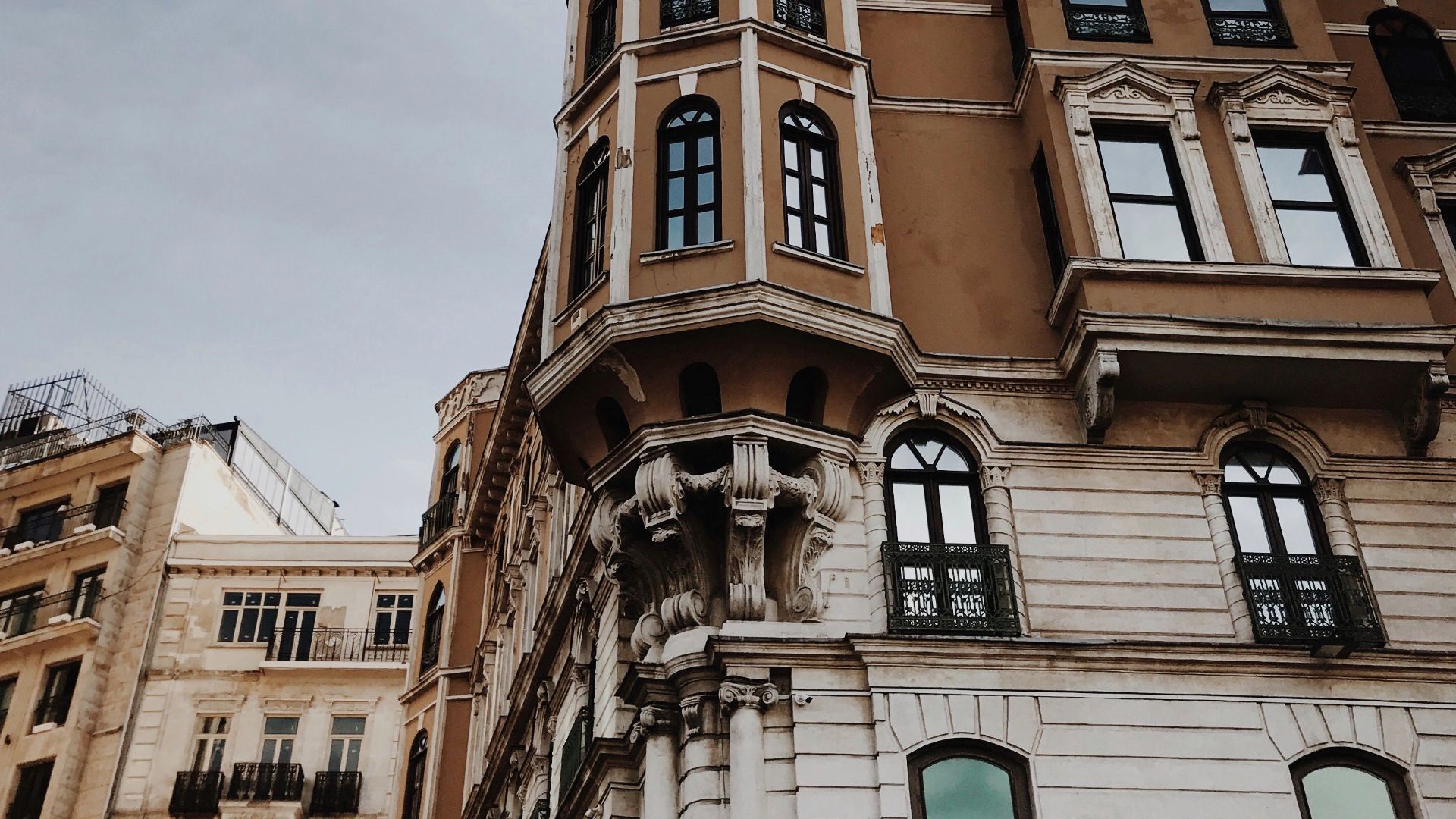 A stunning historical building featuring bay windows, showcasing classic architectural design in an urban setting.