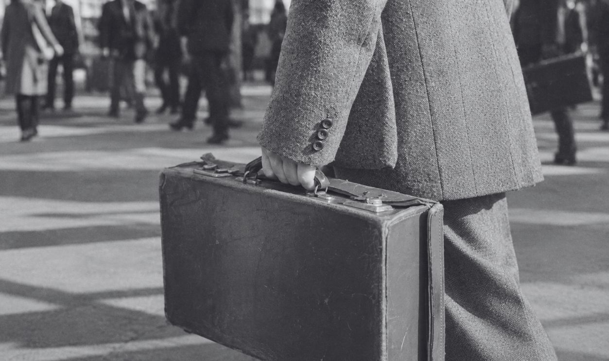 traveler carrying suitcase