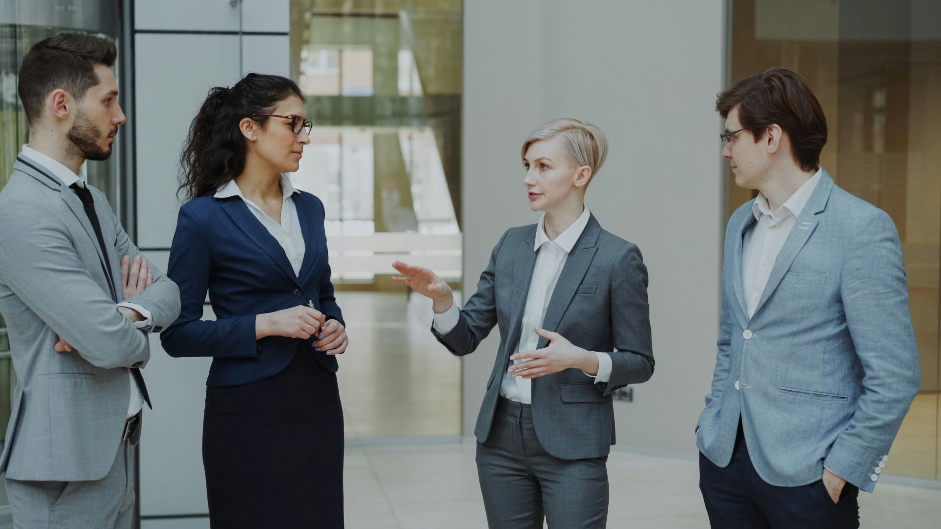 Four business professionals in a meeting discussing ideas
