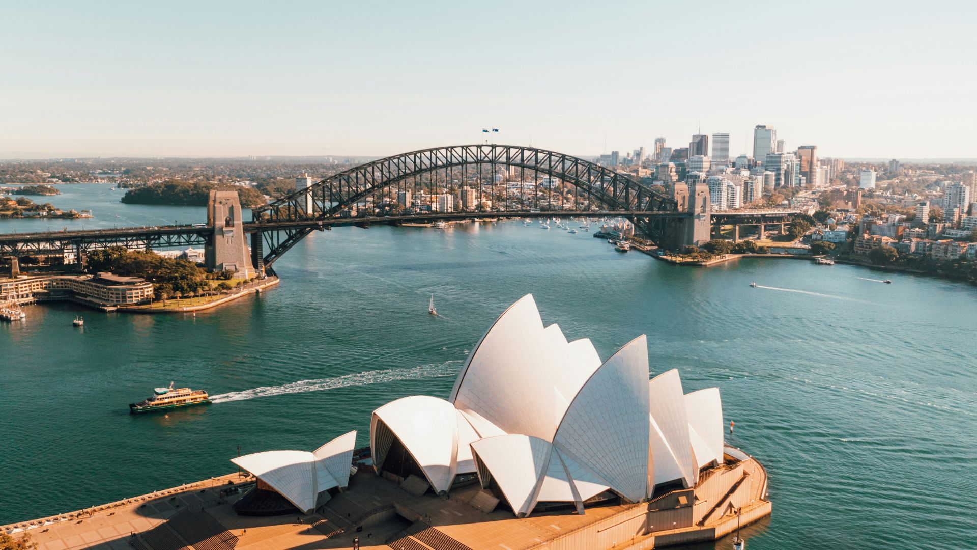 sydney opera house near body of water during daytime