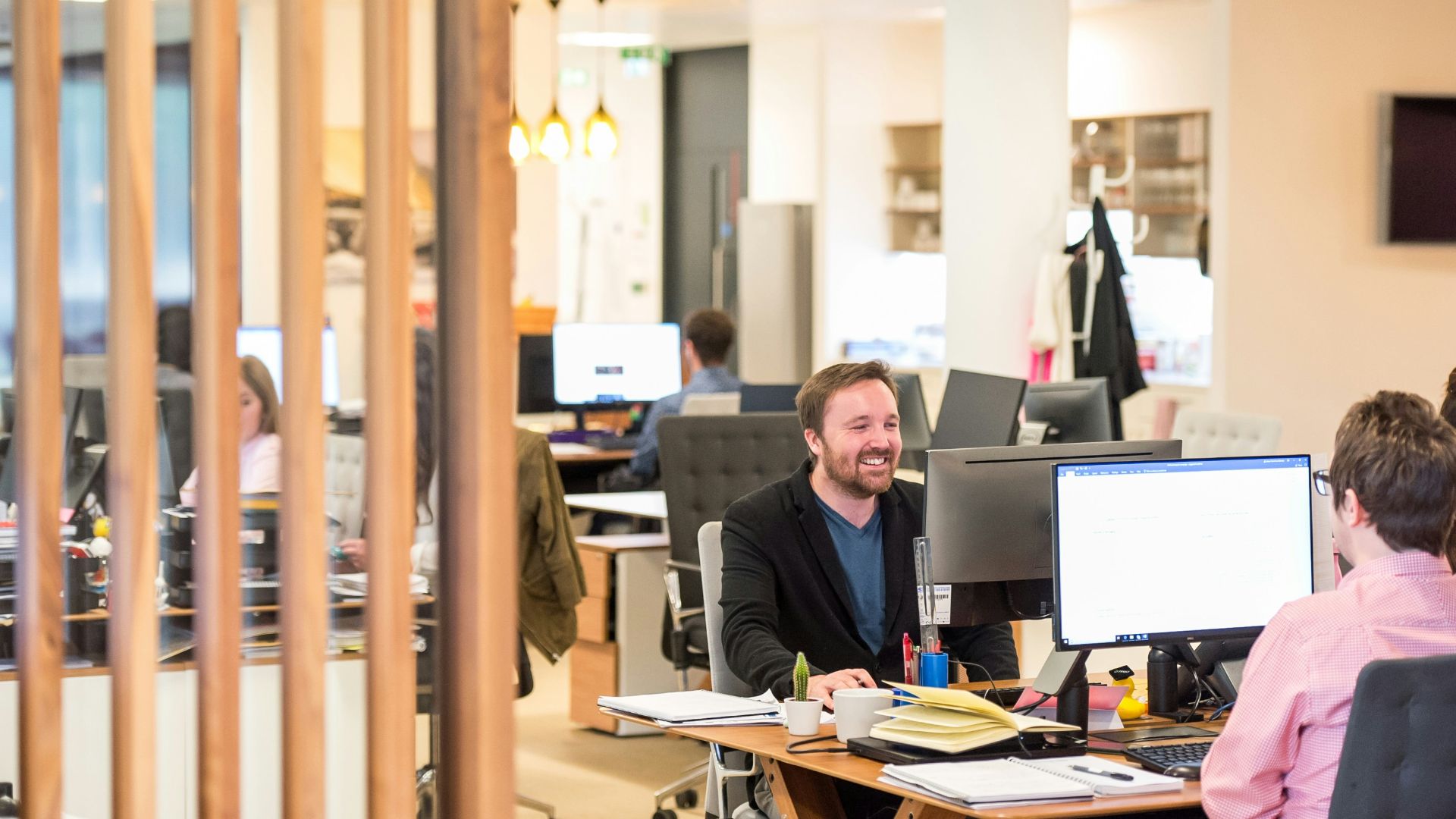 a man sitting at a desk in an office