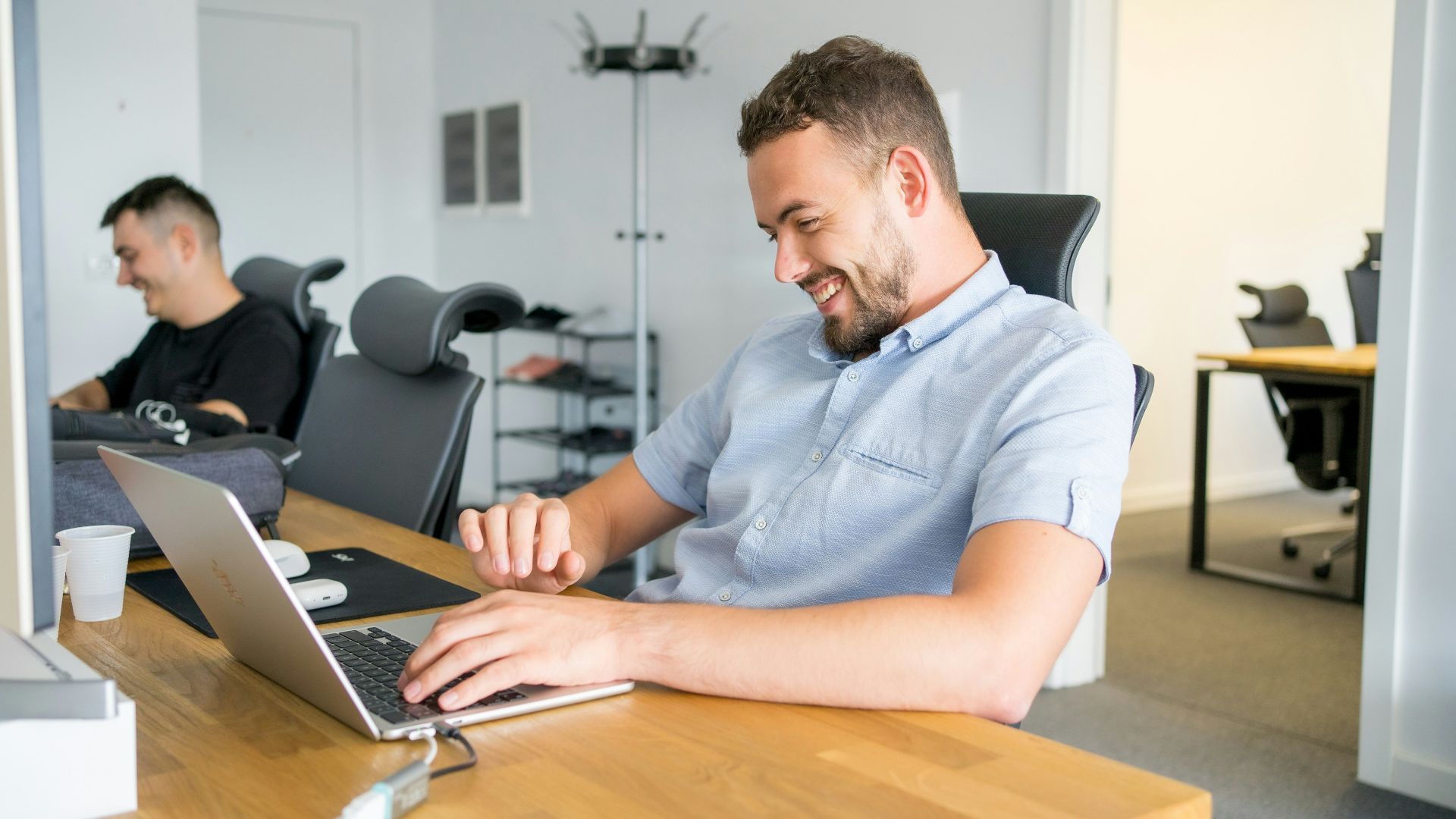 a man sitting in front of a laptop computer