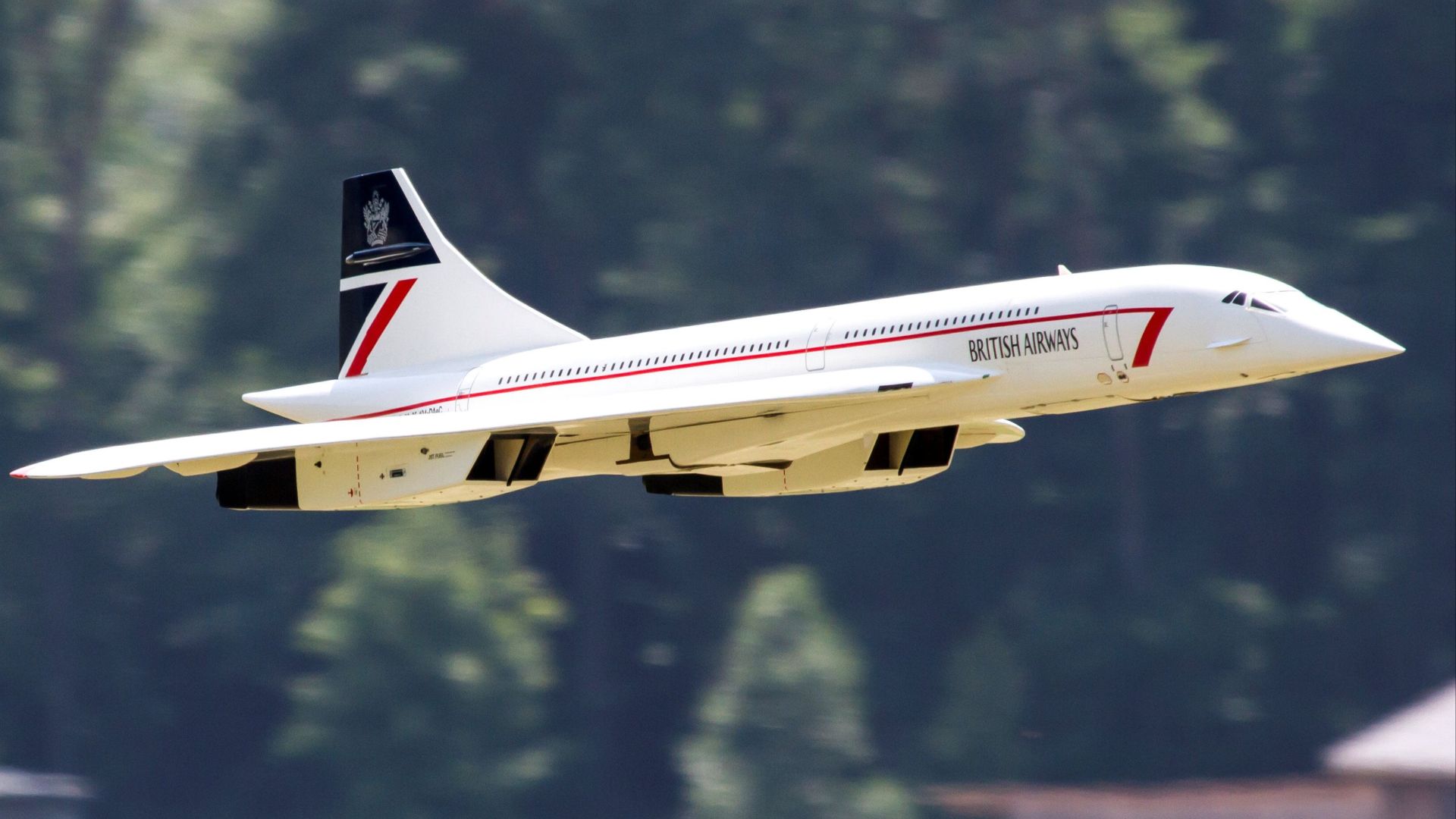 RC model Concorde jet flying outdoors in British Airways livery.
