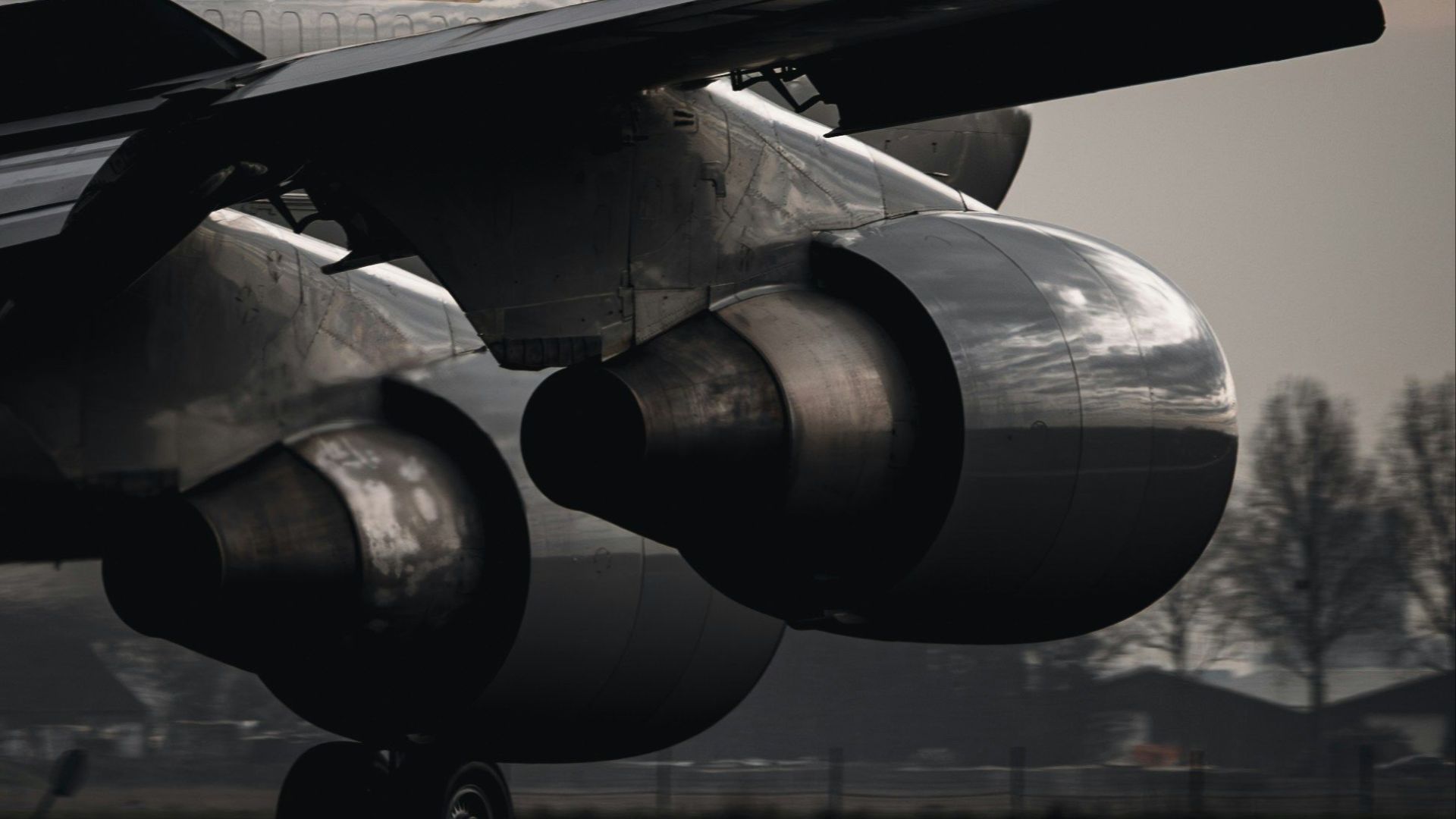 Close-up of a Boeing 747 aircraft during takeoff at Schiphol Airport.