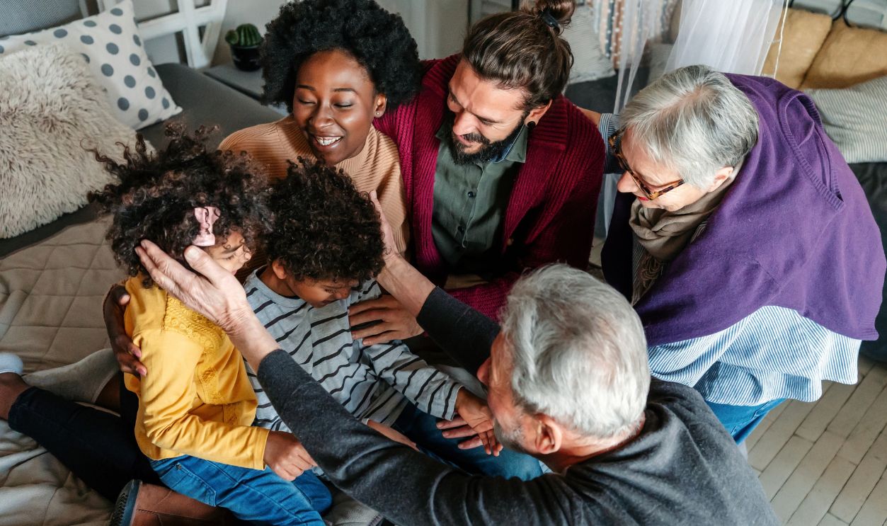 Three generational happy multiethnic diverse family having fun, enjoying time together at home