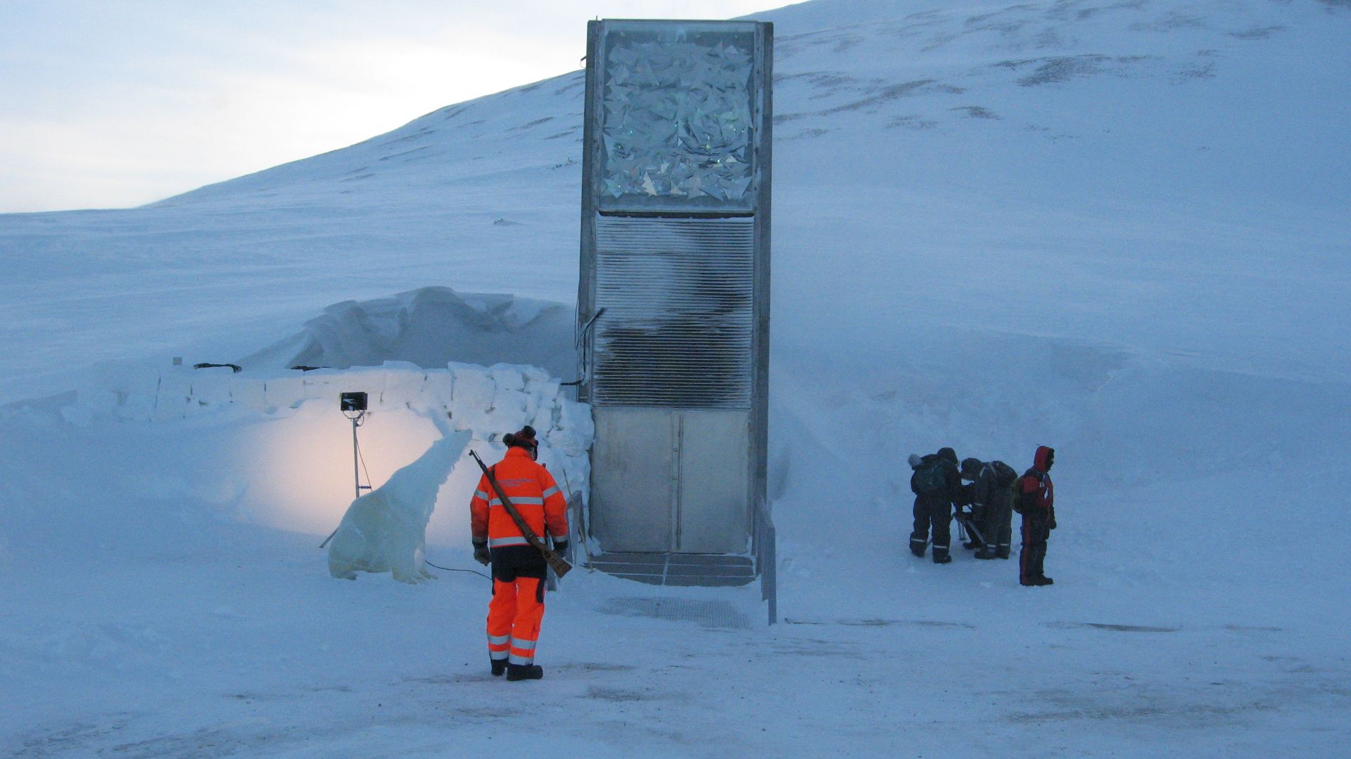 Svalbard Global Seed Vault, February 2008. During the opening the vault was guarded by an armed guard and an ice sculptured polar bear. The armed guard was present to provide protection from real polar bears.
