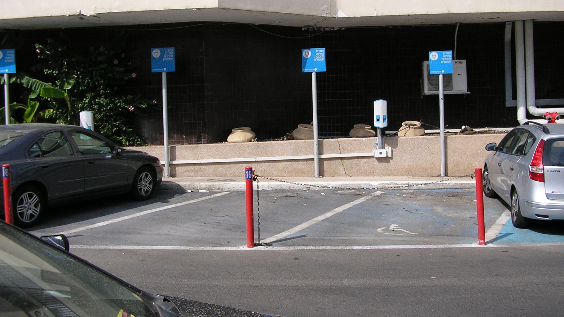 Electric car charging stations outside of the car parking in Leonardo Club Hotel, Tiberias