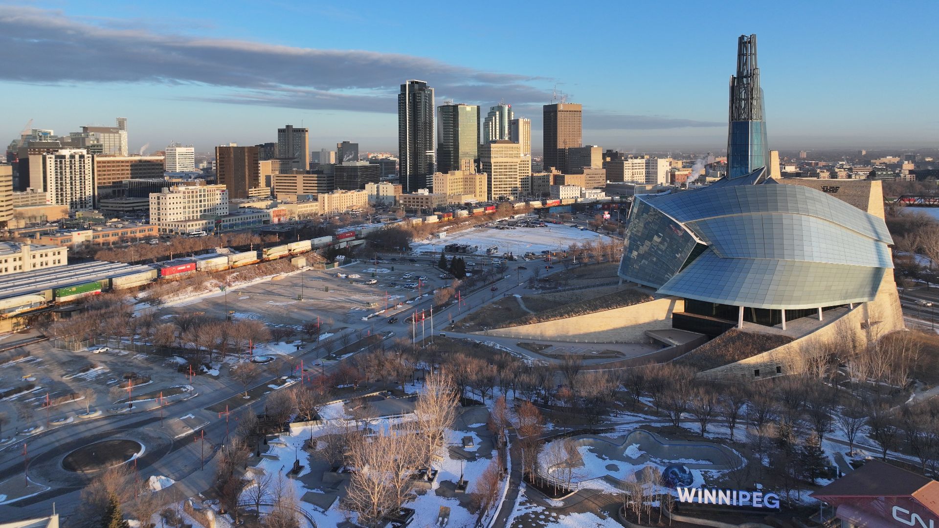 Aerial view of the skyline of Winnipeg, Manitoba, Canada, with the Canadian Museum for Human Rights (CMHR) at The Forks in the foreground.
