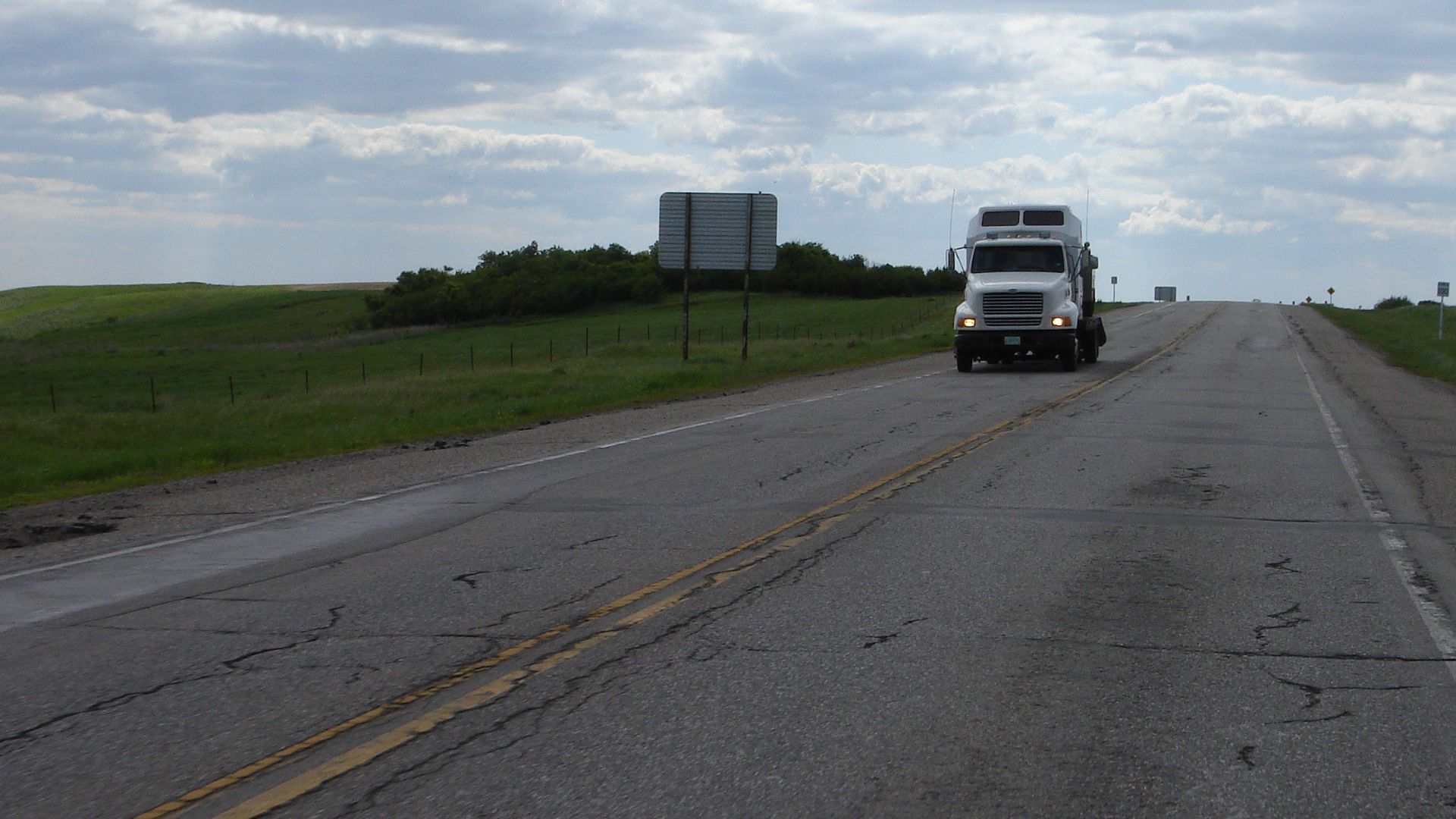 Two way section of SK highway 11 showing yellow double line in center of highway indicating passing is not allowed.
Taken from Saskatchewan Highway 11, Louis Riel Trail travelling south from Saskatoon to Regina There is no divided highway near Chamberla
