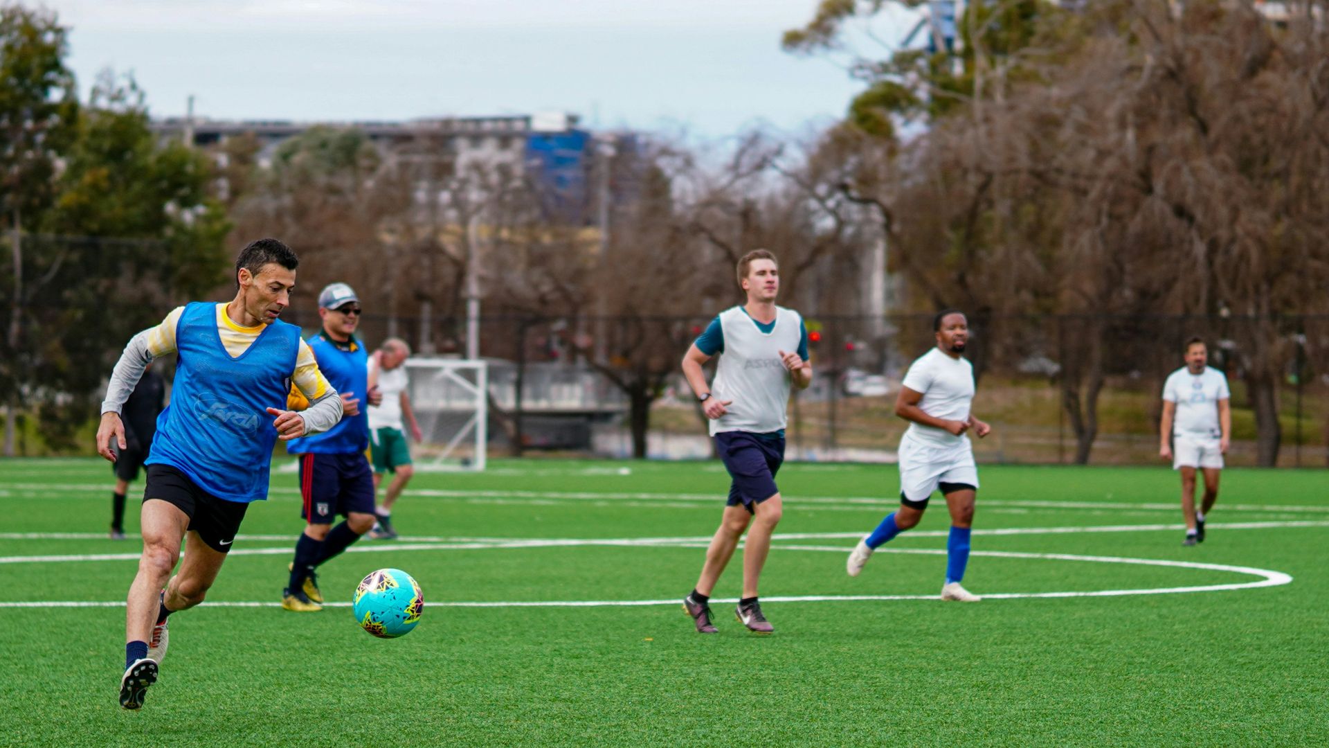 A group of men playing a game of soccer