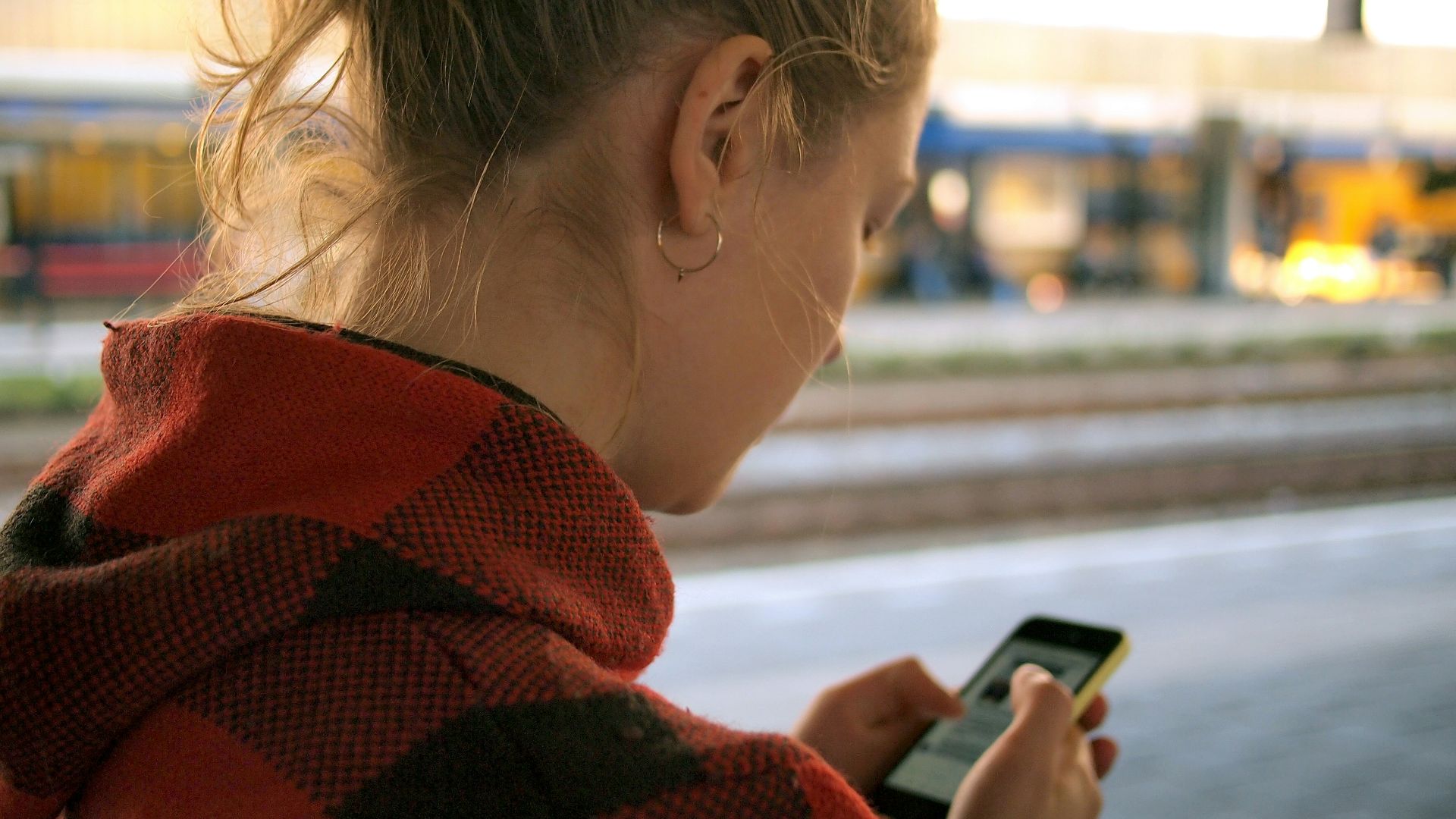 woman holding phone