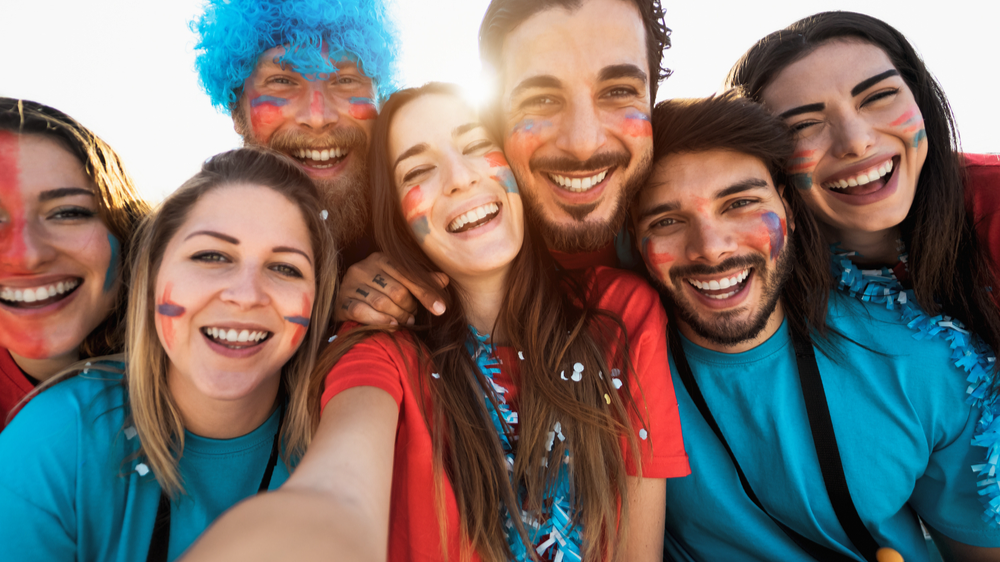 Football fans taking selfie