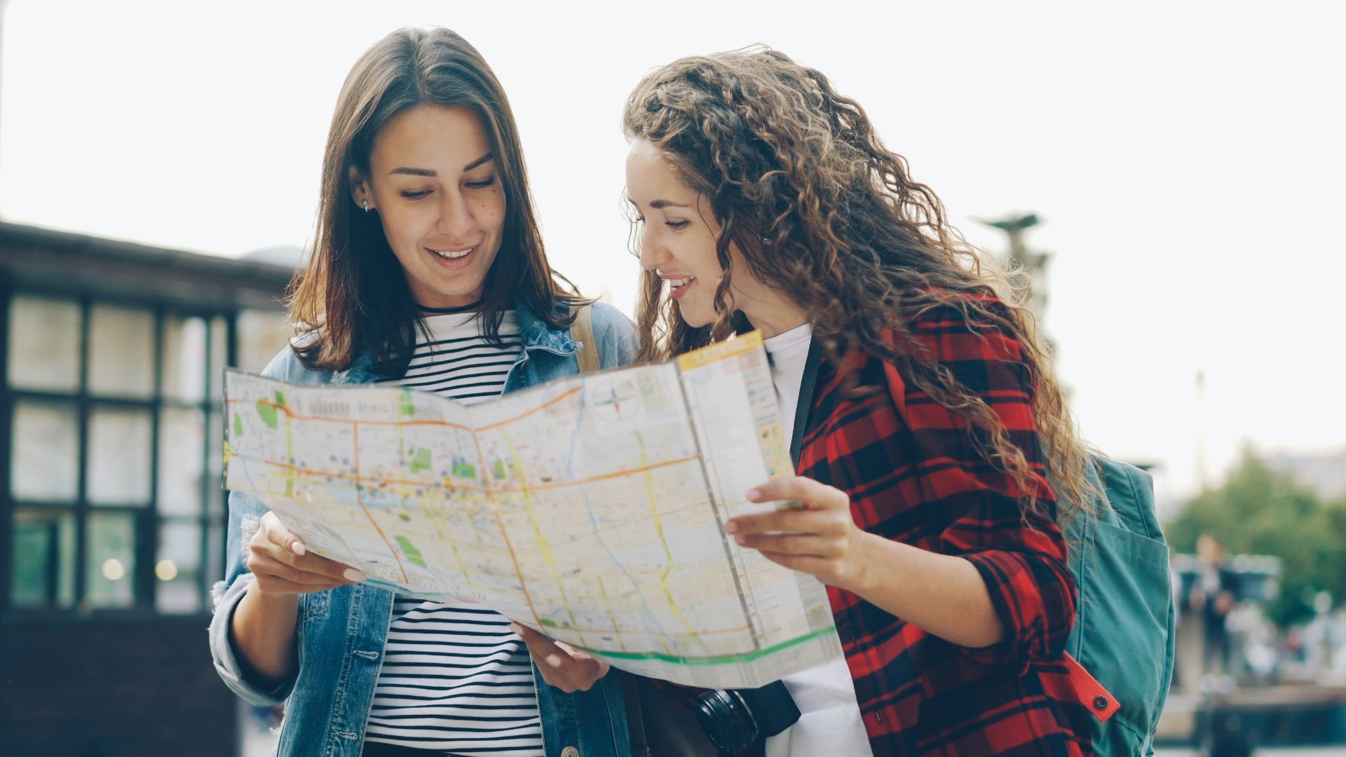 Two women are looking at a map together