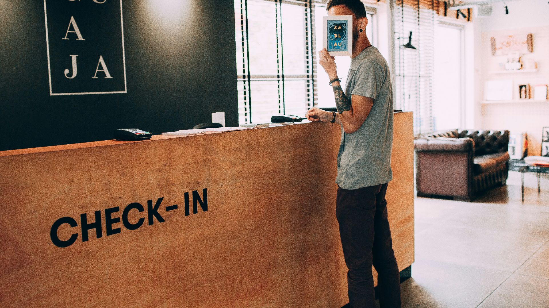 man standing beside counter