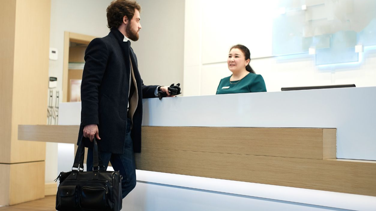 Shutterstock-1668207475, young handsome businessman in fashion coat, casual clothes wants to stay in the luxury hotel