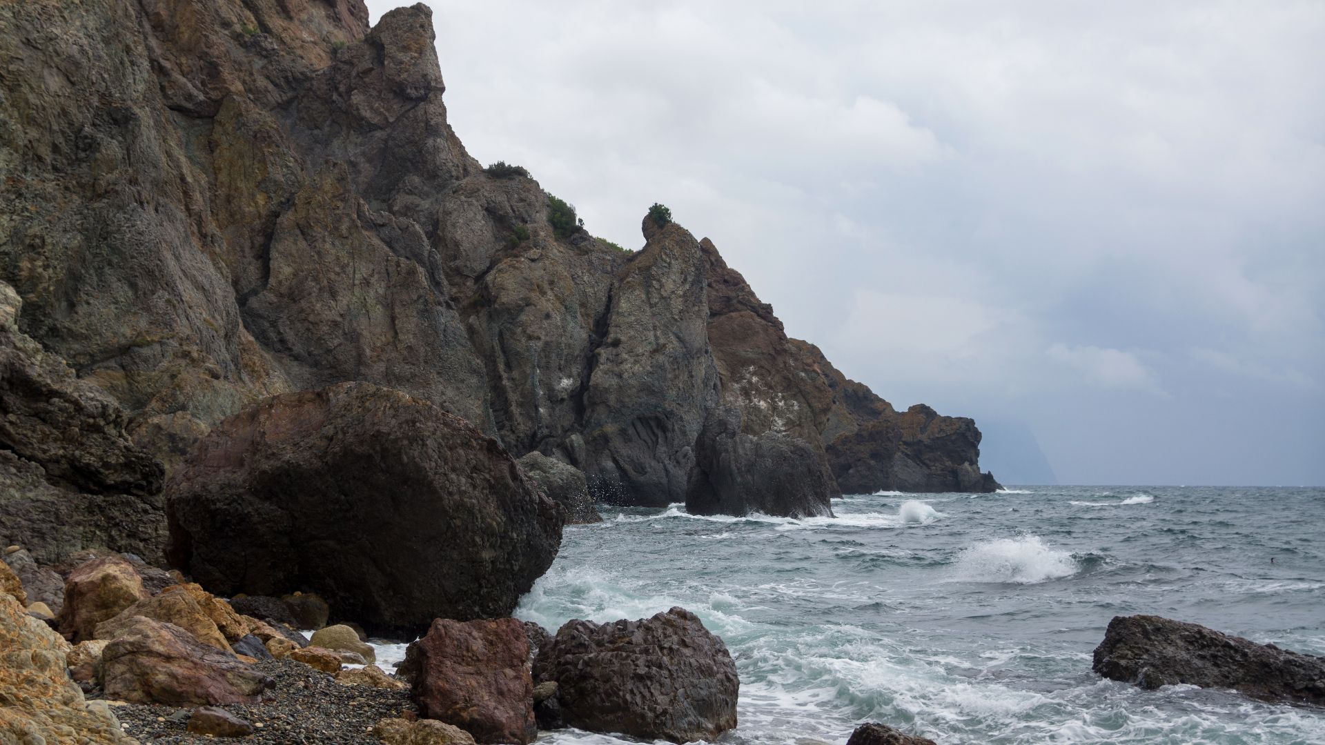 Fiolent, Crimea, Black Sea. The rock formations around Cape Fiolent of Heracles Peninsula are ophiolites lifted from ancient crust of back-arc basin. Parts of Heracles Peninsula in Crimea are of ancient Jurassic origin. Upper Miocene lava and carbonate in
