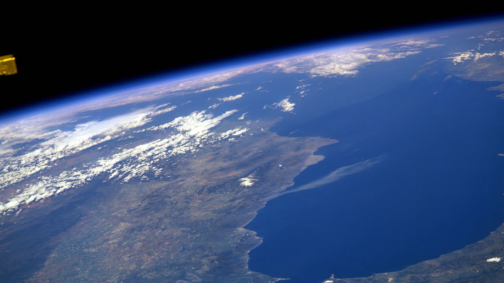 The Strait of Gibraltar (bottom center), the only opening between the Mediterranean Sea (right center) and the Atlantic Ocean, is not only narrow (10 miles-16 km) in width but shallow (1300 feet-396 meters) as well. The northern peninsula of Morocco (lowe