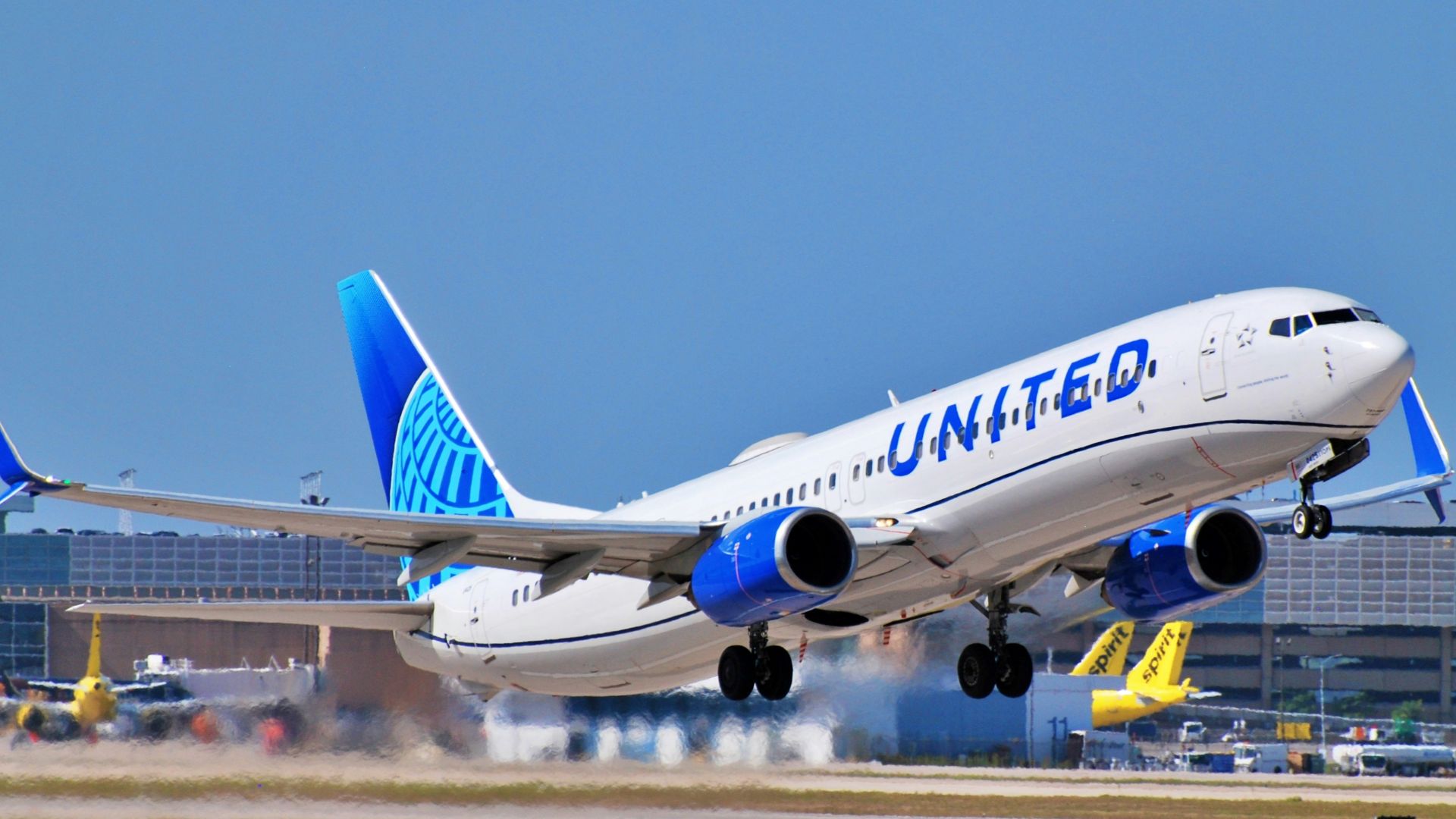 a large jetliner taking off from an airport runway