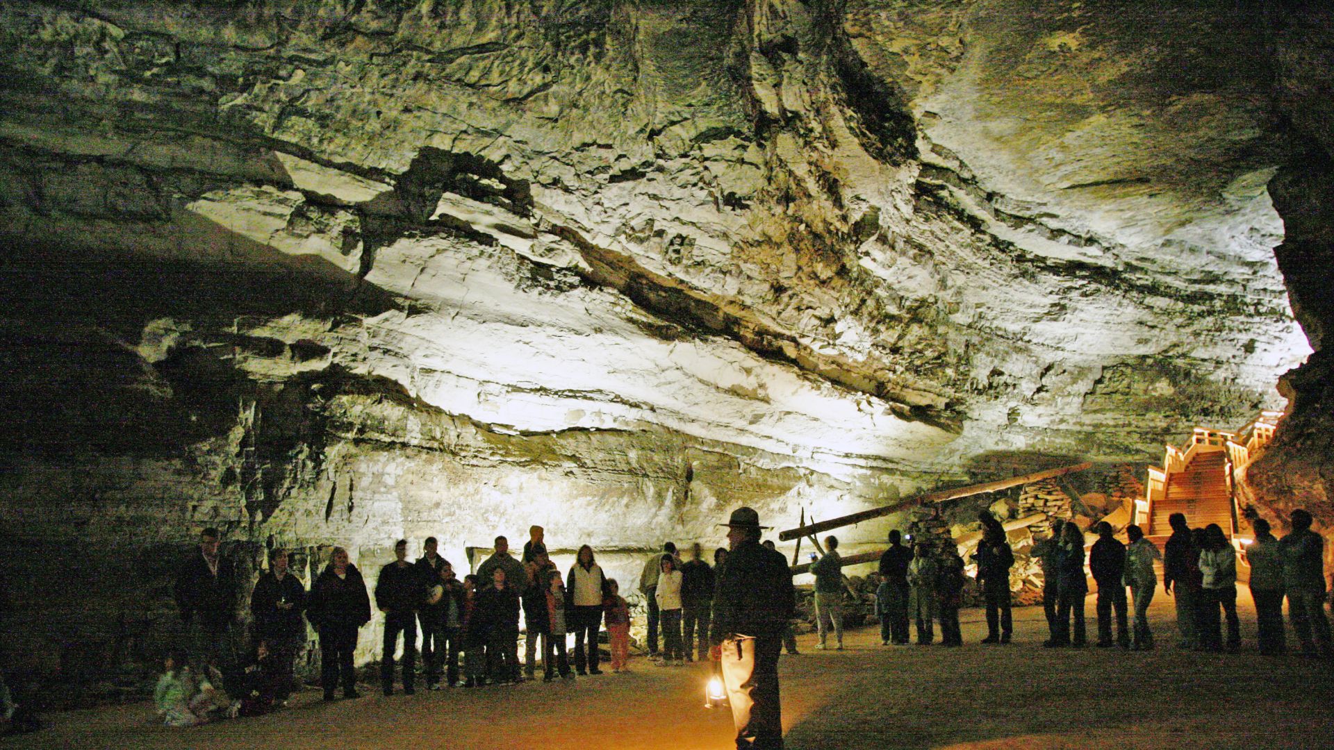 A national park ranger guiding tourists through Mammoth Cave.