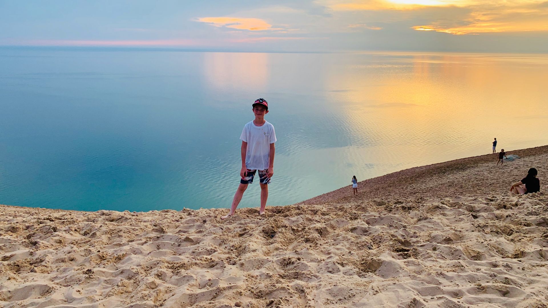 a man standing on top of a sandy beach