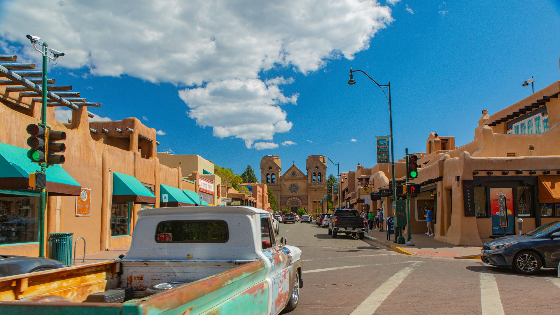 A street with cars parked on the side of it