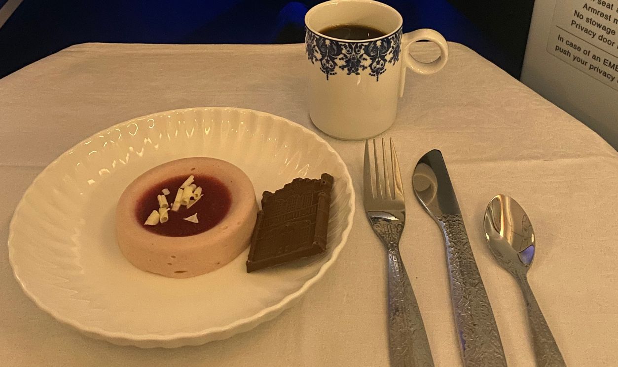 LEEDS, UNITED KINGDOM- APRIL 9, 2025: Close up desserts served on board with Interior design and cabin decoration of business class of 'KLM royal Dutch airlines' a member of Skyteam alliance