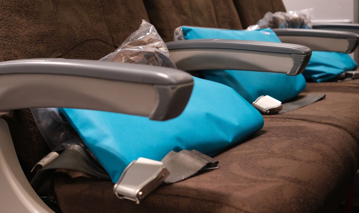 The pillows and blankets provided for free on the airplane.