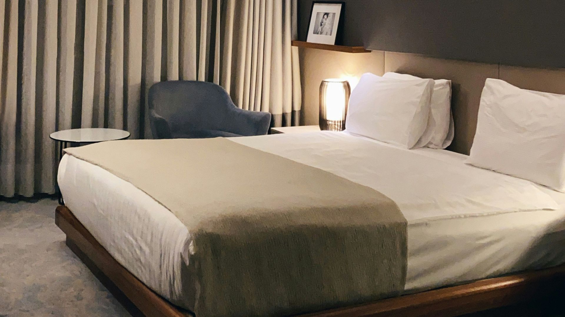 white bed with gray pillow