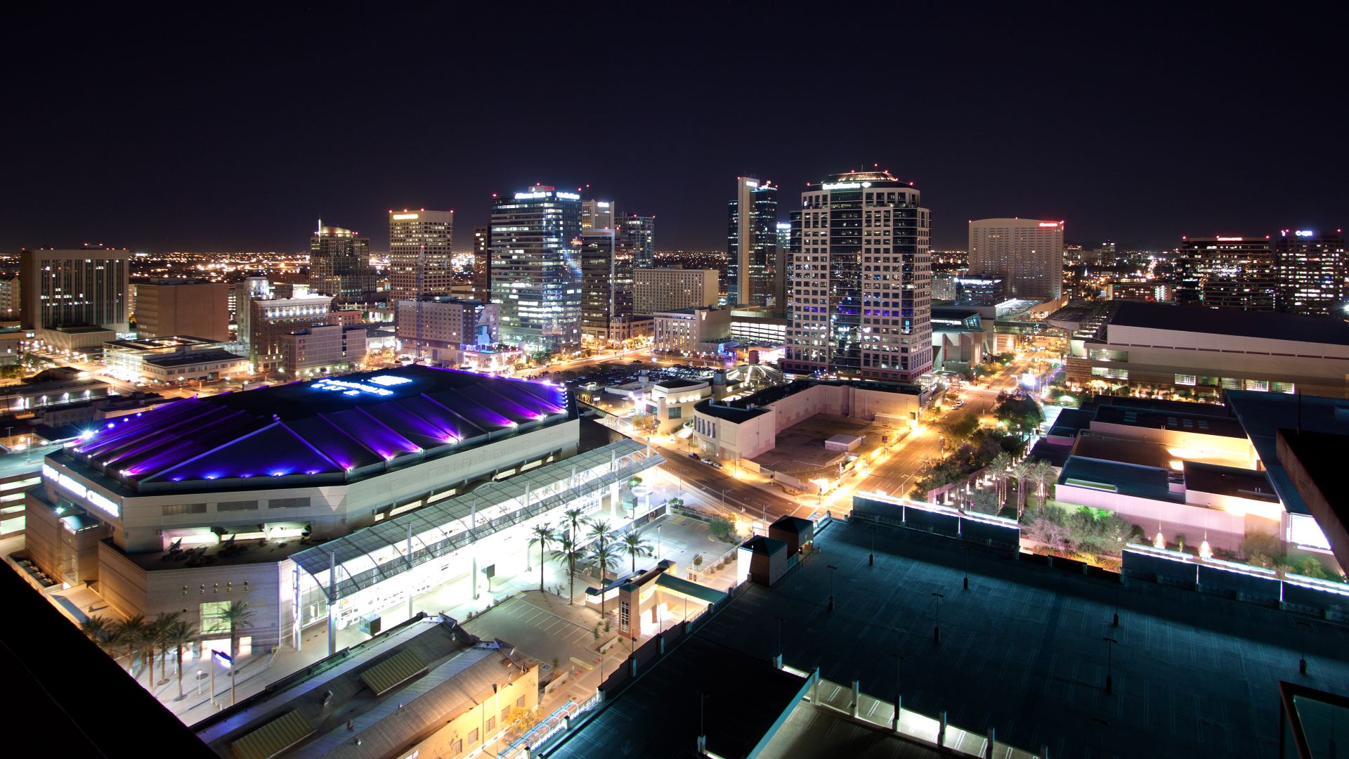 Downtown Phoenix, Arizona skyline at night as seen from on top of the Summit at Copper Square condos.