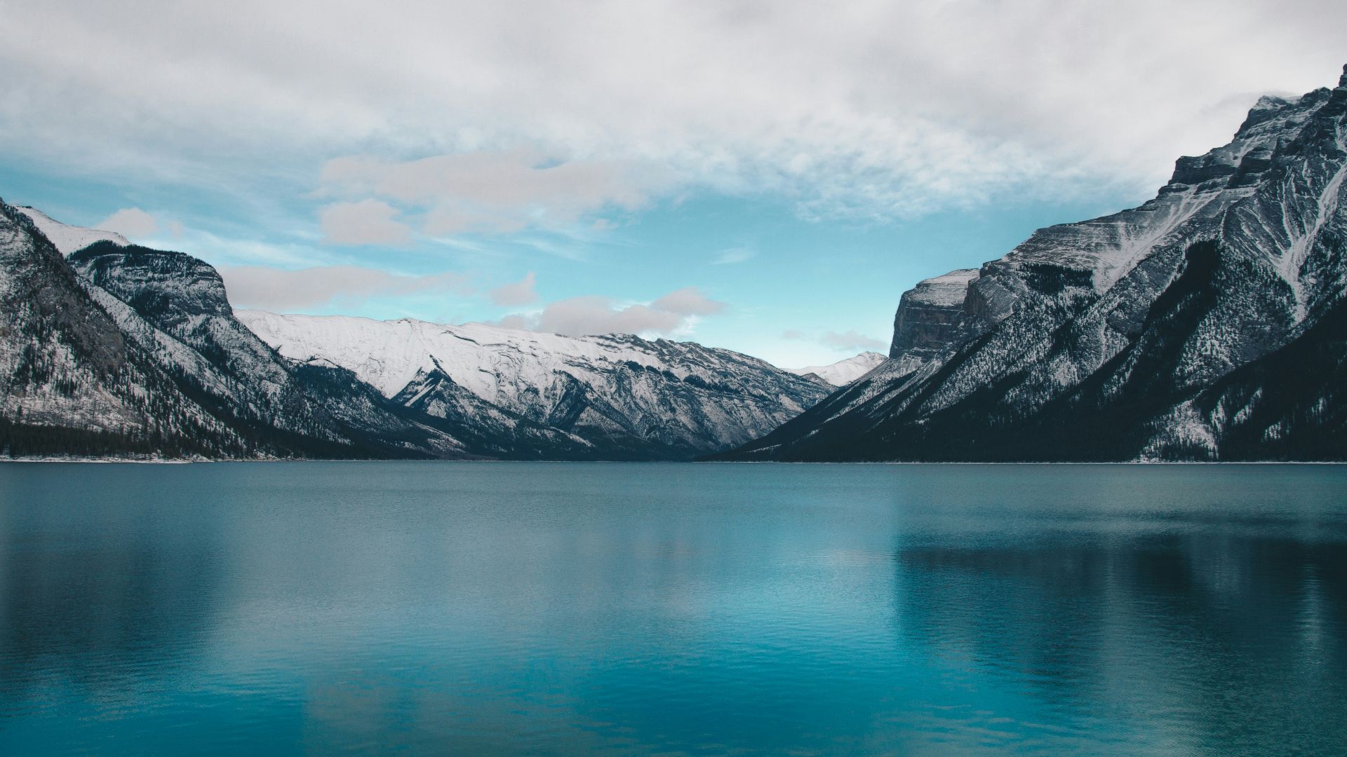 body of water under cloudy sky