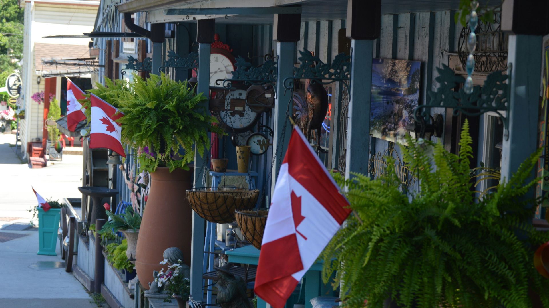 a store front with flags