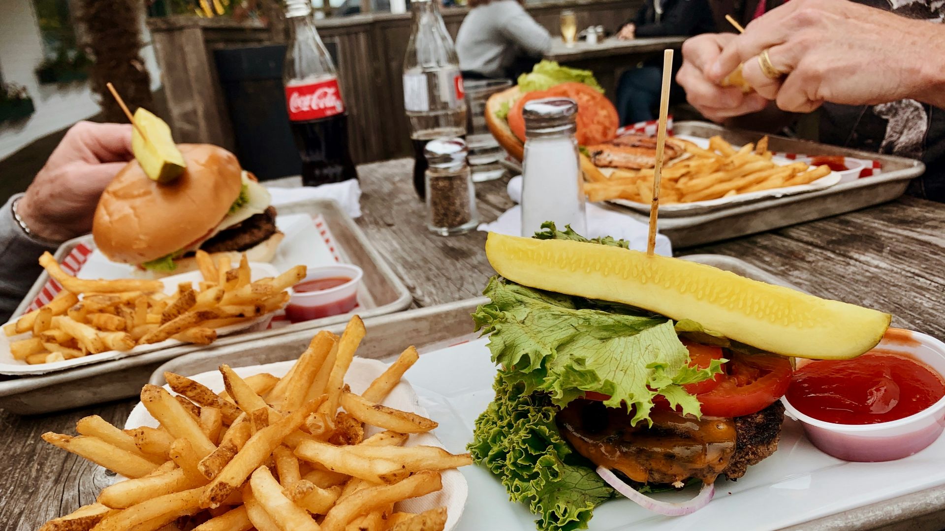 potato fries near burger with cabbage beside ketchup